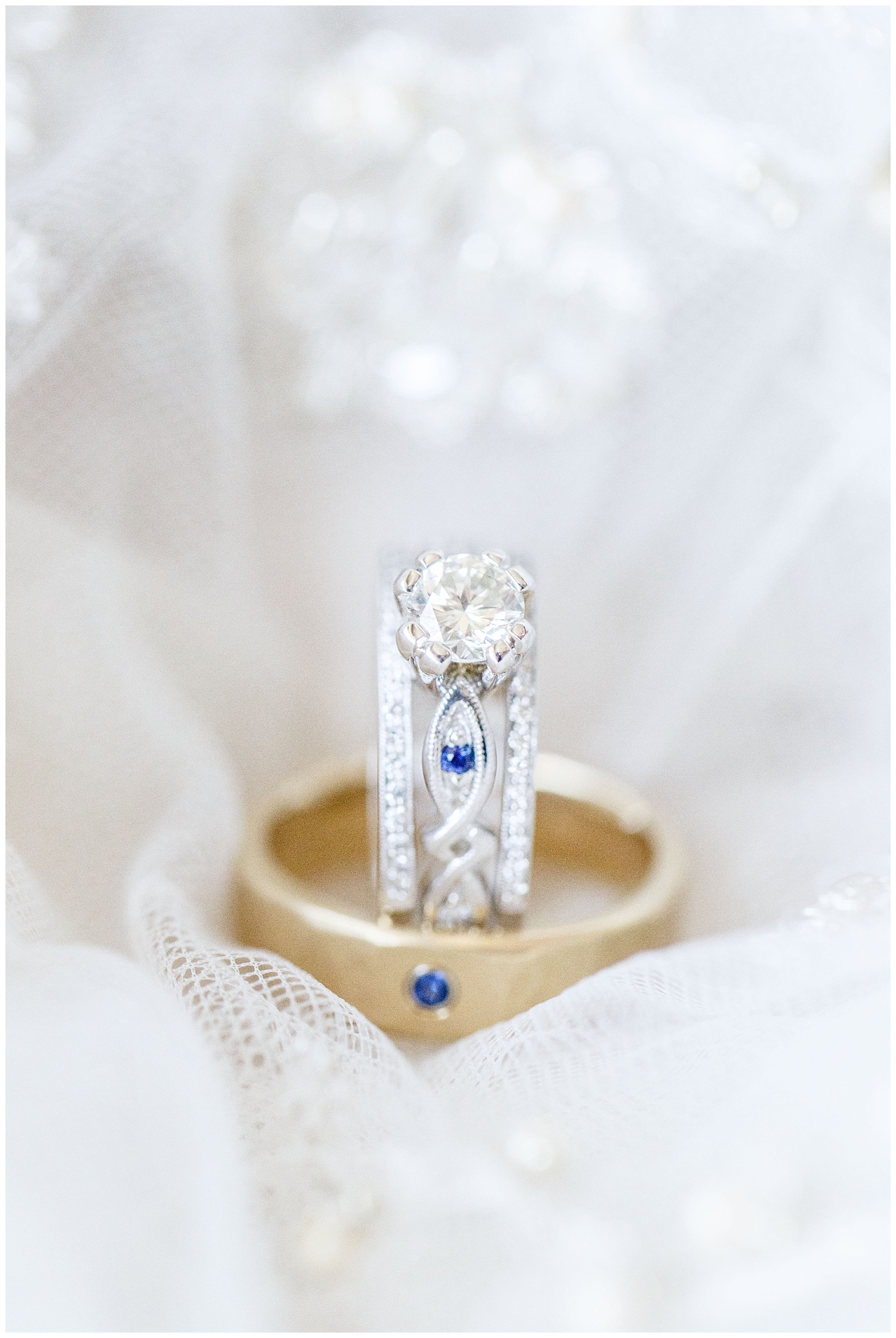 custom ring with blue stones and gold wedding band